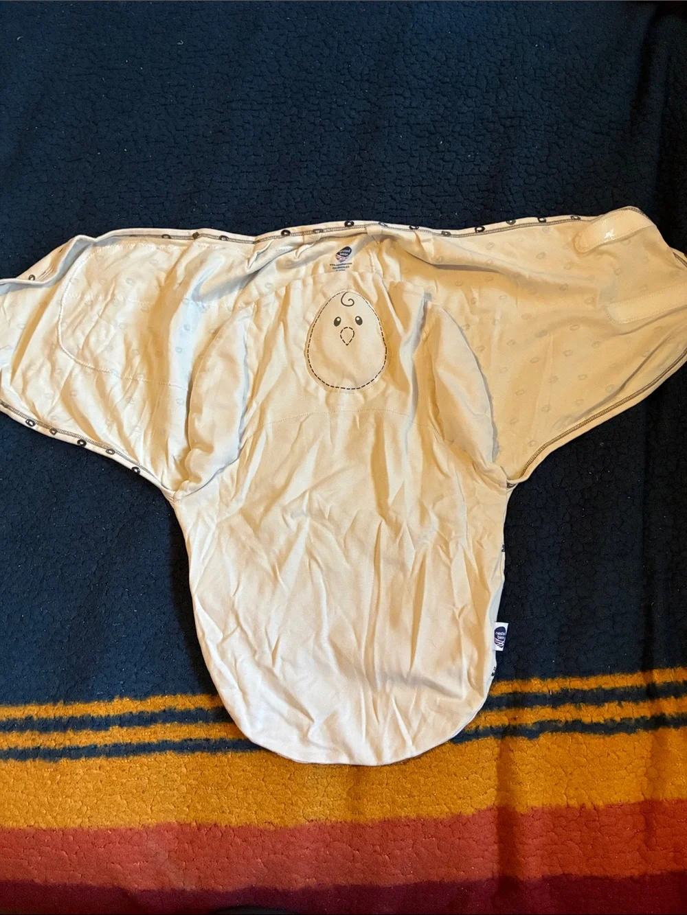 Nested Bean Cream Swaddle with Black Dot Accent
